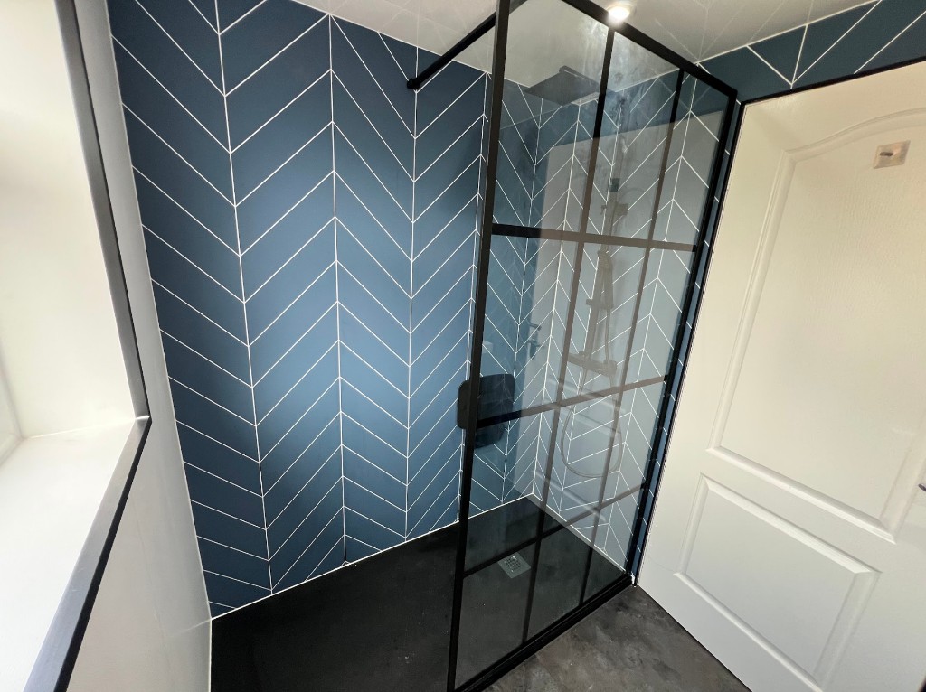 Ensuite upgrade in Westerhope, Newcastle with Royal Blue Chevron tile-effect panelling and black shower screen