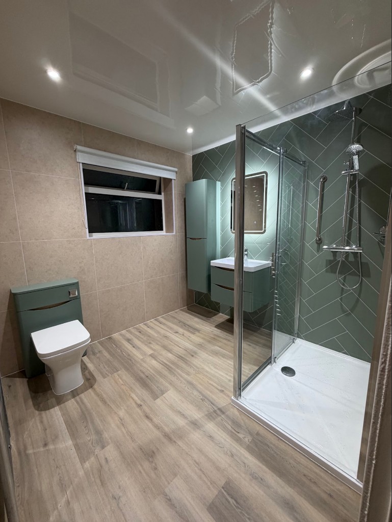 Bath-to-shower conversion in Heaton, Newcastle with sage green herringbone and Sementi Torta panelling